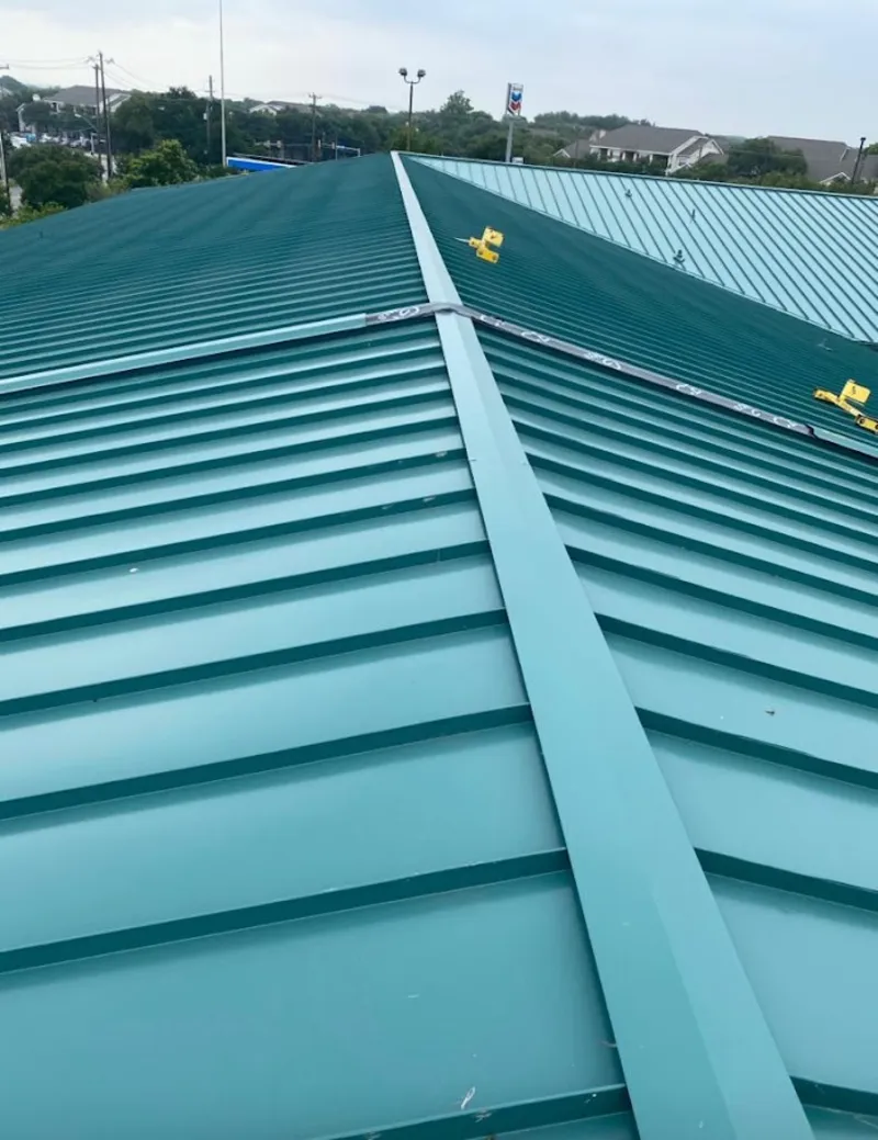 Green commercial metal roof ridge and valley for Metal Roof Repair in Painesville